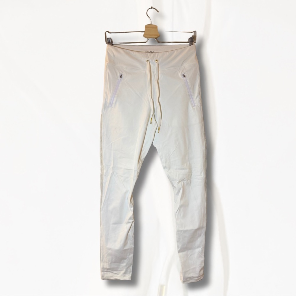 Alala Fast Track Pant in white with mesh side panels